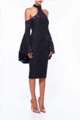 A woman wearing a black lace halter dress with bell sleeves on a transparent background.