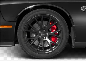 Close up of a black car wheel with a red brake caliper on a transparent background.