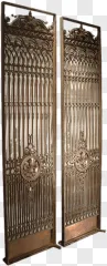 Ornate wrought iron security gates with intricate vintage metalwork displayed on a transparent background.