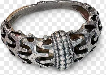 An ornate silver filigree bangle with beaded detail on a transparent background.