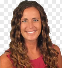 Smiling woman with long wavy hair wearing a red top on a transparent background.