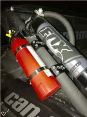 An off road vehicle fire extinguisher mount attached securely on a transparent background.