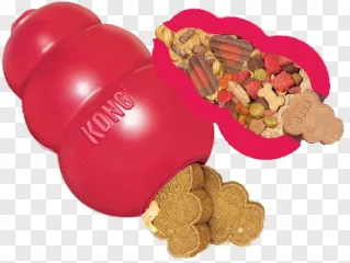 A red Kong dog toy filled with treats on a transparent background.